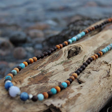Load image into Gallery viewer, Blissful Heart wrap mala displayed on wood